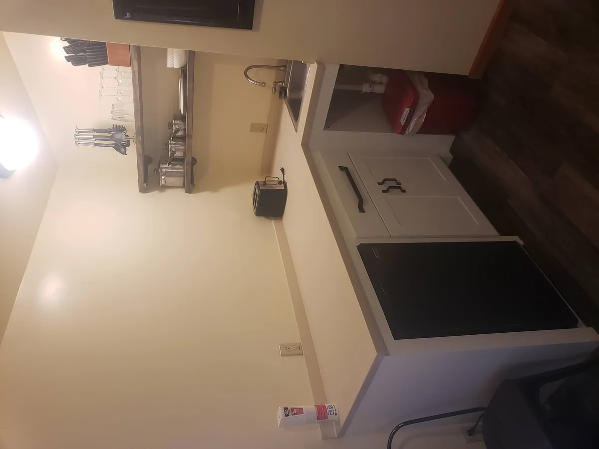 Kitchen cabinet installation in progress during remodel