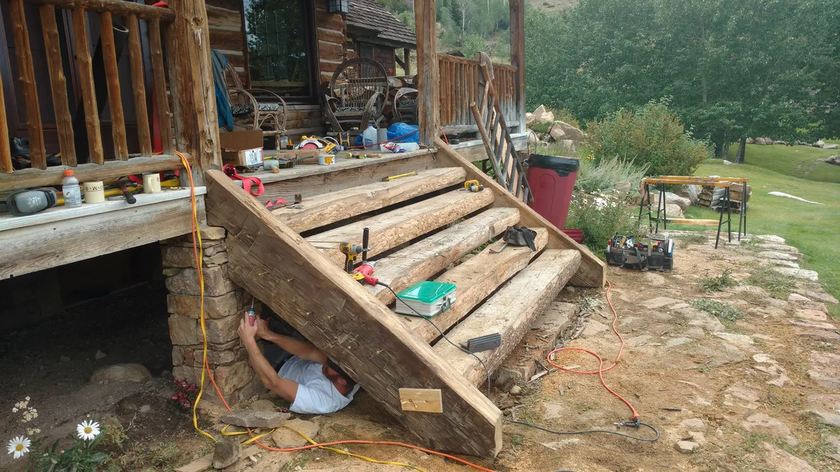 Covered porch construction showing gable roof structure and exposed framing
